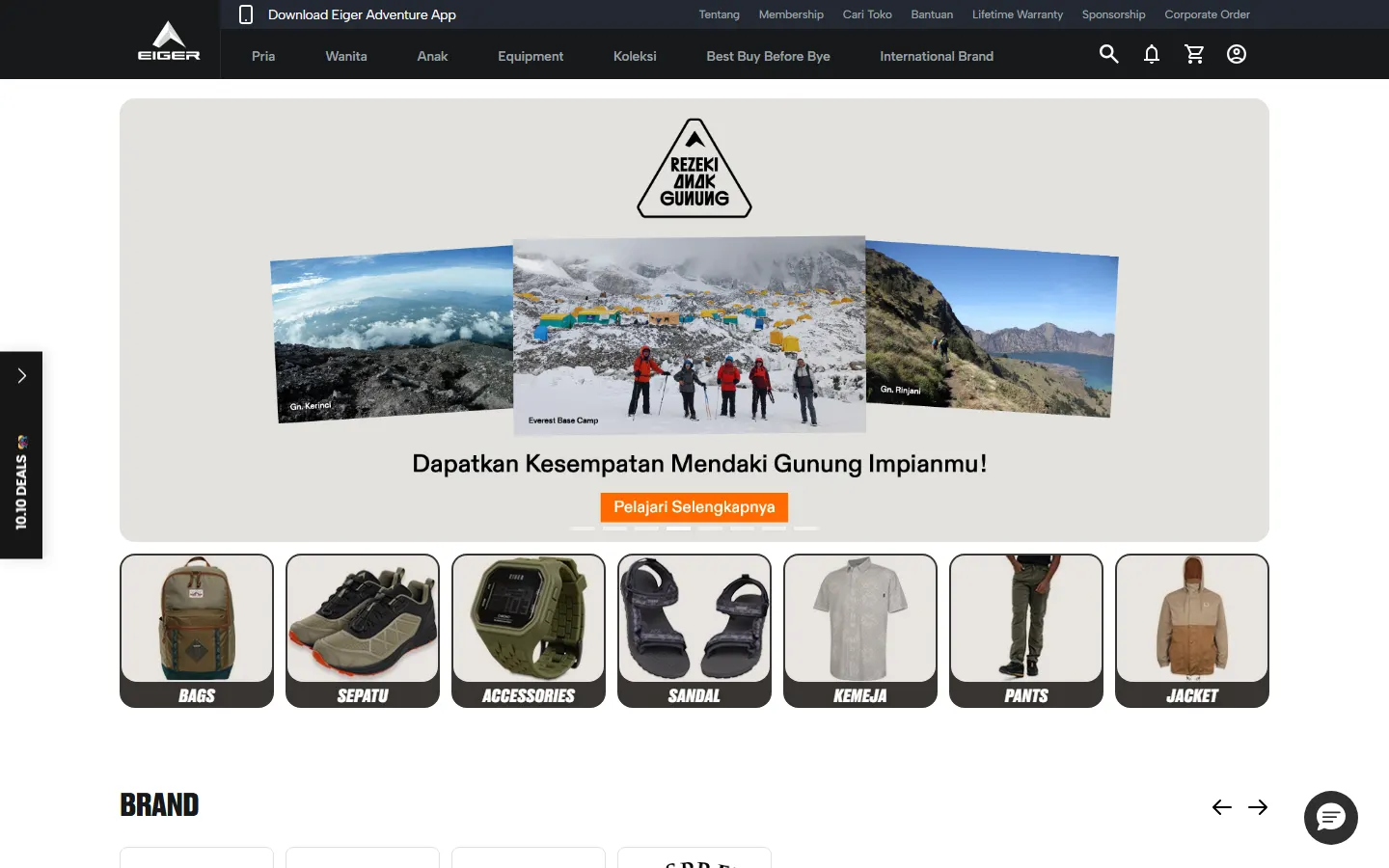 Tangkapan layar beranda eigeradventure.com: logo Eiger, menu Pria, Wanita, Anak, Equipment, Koleksi, ikon pencarian, notifikasi, keranjang, dan akun, banner promosi pendakian gunung, serta tujuh kartu kategori produk Bags, Sepatu, Accessories, Sandal, Kemeja, Pants, dan Jacket